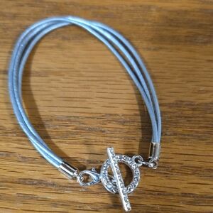 Elegant Silver Bracelet with Grey Cord